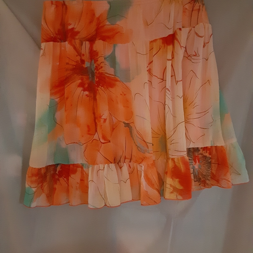Orange skirt size L new with tags Cute To Wear As A Cover Up For Bathing Suit.